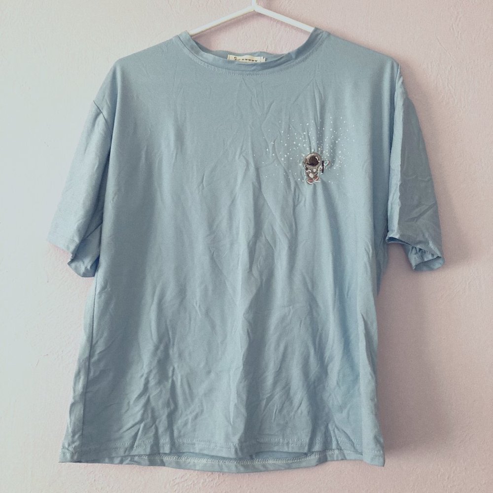 Oversized light blue astronaut T-shirt